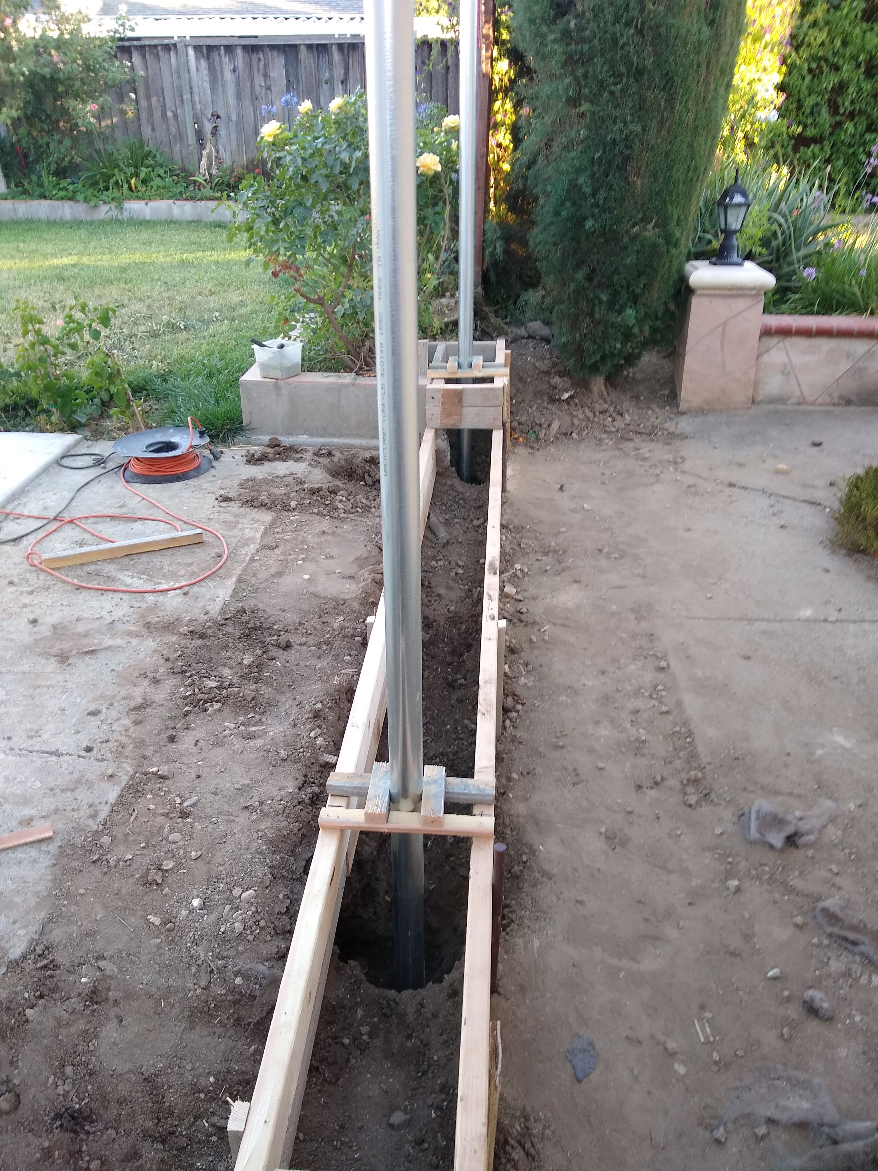 Setting up the steel posts and concrete footings